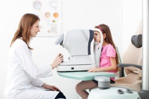 eye doctor working with child