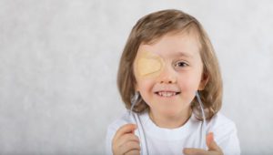 child with eyepatch for lazy eye correction