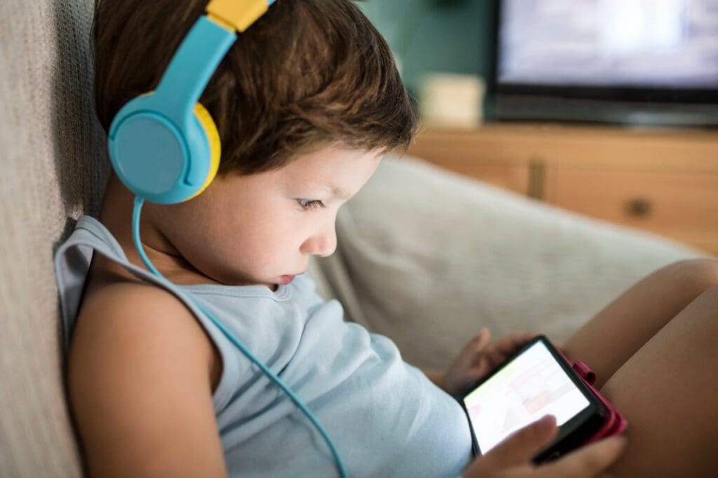 kid staring at phone screen