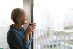 old woman sipping tea