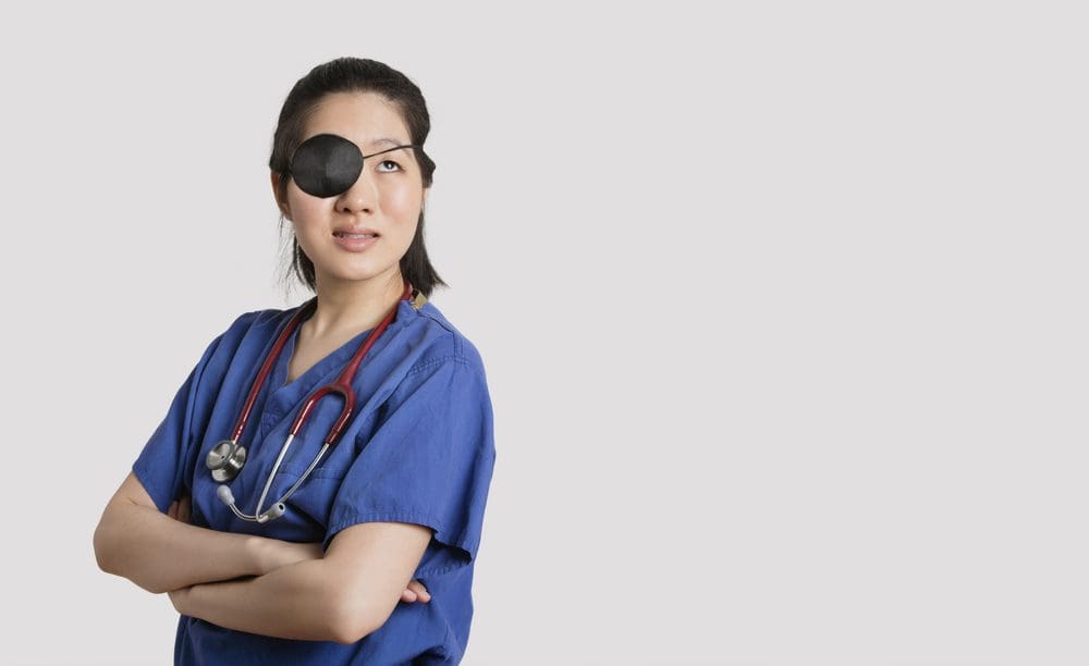 woman wearing eyepatch.