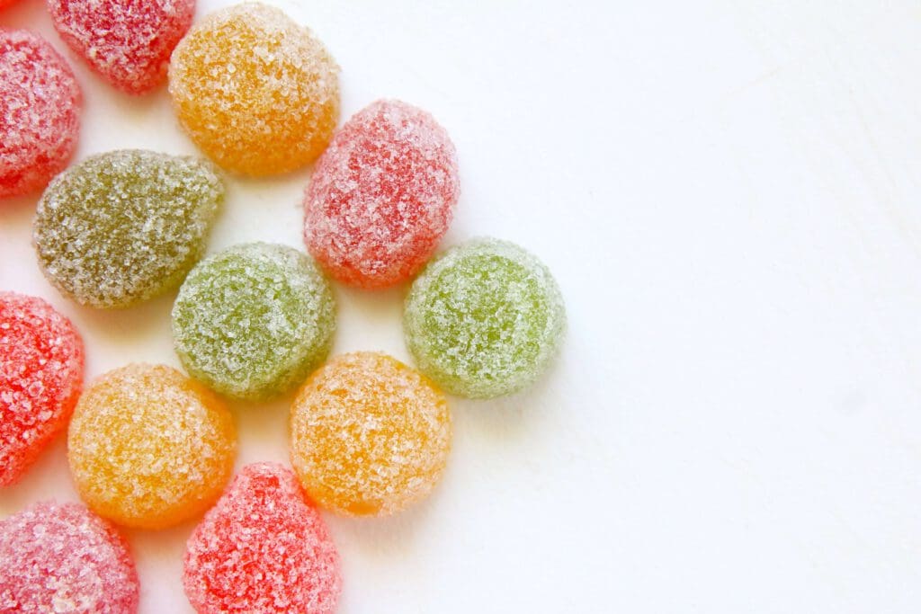 sugary gummies on a white surface
