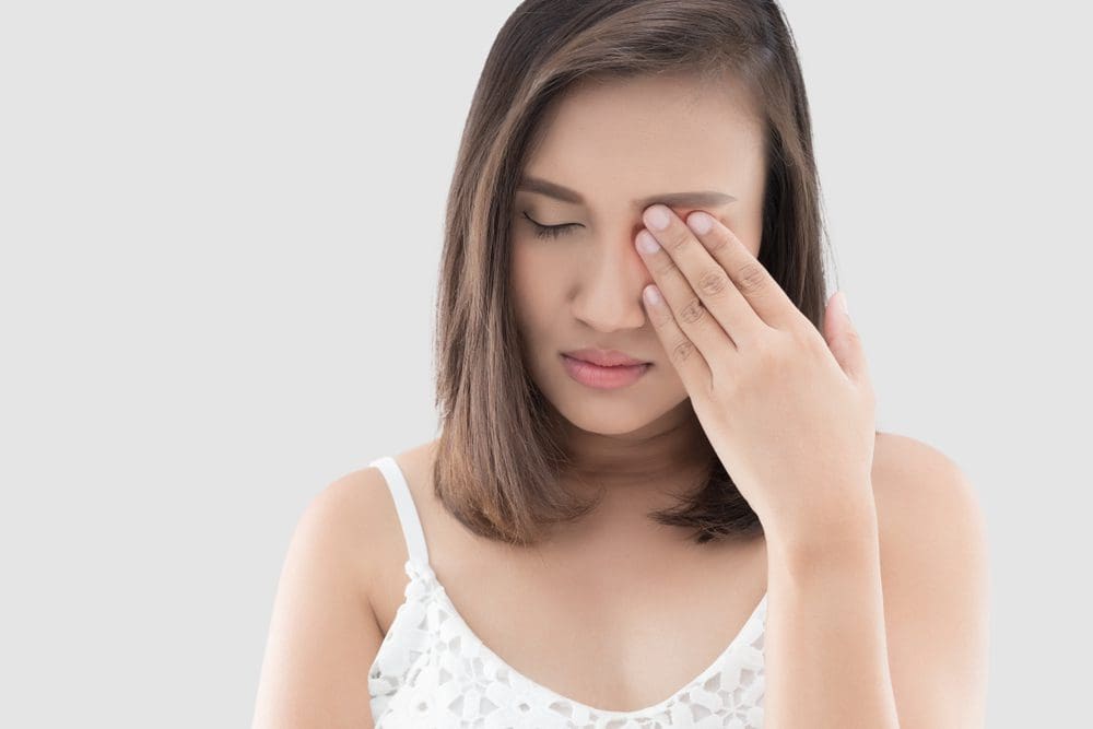 woman experiencing eye burn